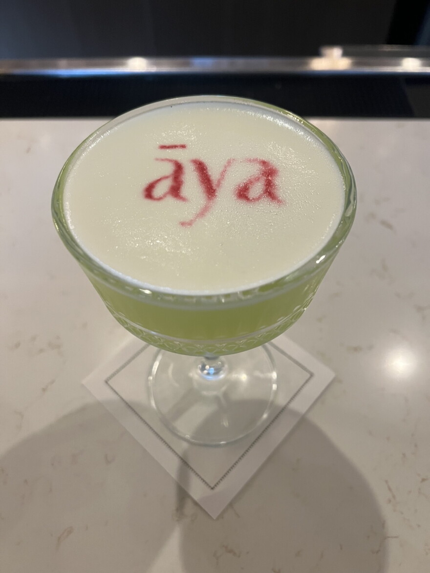 Āya's Fig cocktail is a spin on a Midori sour, made with fig-flavored vodka, Midori melon liqueur and grapefruit liqueur.