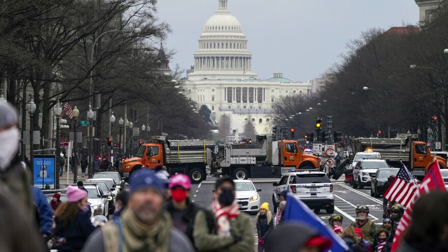 Supporters of President Trump attend a rally at Freedom Plaza on Tuesday, a day before Congress meets to certify the 2020 Electoral College results. [Jacquelyn Martin / AP]