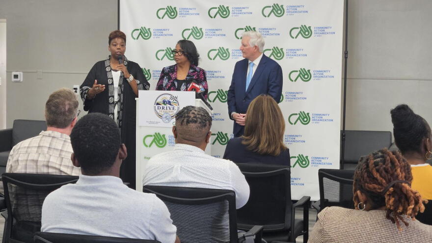 Melanie Porter, Community Action Organization of WNY Hope Initiative senior program director, far-left, describes the impact of CAO's new DRIVE for Success program, alongside CAO President Marie Cannon and Erie County Clerk Mickey Kearns.