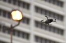 A drone flies next to a building in Atlanta.