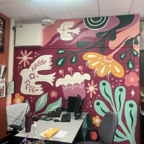 After their art classroom flooded, Riverside University High School art teacher Paige Bauske and her students painted this mural to bring color and new life back into the space. Many of the art materials were lost in the August 2025 floods.