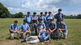 Members of the Capital Base Ball Club pose in vintage uniforms.