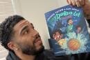 Co-author Jayson Tatum hold his new book, "Baby Dunks-A-Lot: The Day the Basketballs Stopped Bouncing." (Courtesy of Jayson Tatum)