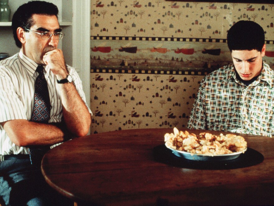 Eugene Levy with Jason Biggs and the now-infamous defaced pie in one of his most popular recurring roles as Jim's dad in <em>American</em> <em>Pie</em>.<em></em>