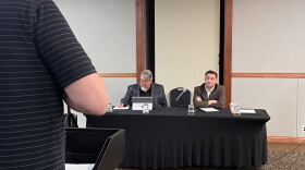 A Laurel residents speaks to a Department of Public Health and Human Services attorney and Board of Investments Executive Director Dan Villa in Billings September 8th.