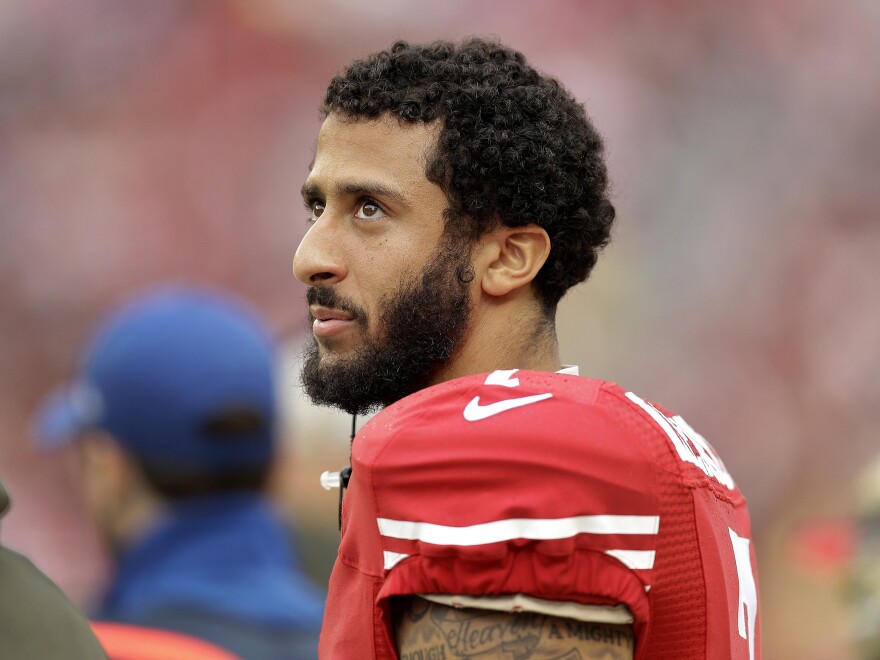 San Francisco 49ers quarterback Colin Kaepernick stands on the field during an NFL game against the Atlanta Falcons in Santa Clara, Calif.