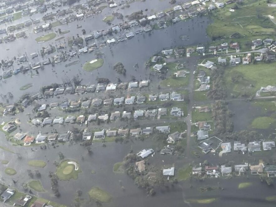 A U.S. Coast Guard aircrew from Air Station Miami, Florida, conducts overflights around the Fort Myers area in the wake of Hurricane Ian, Sept. 29, 2022. Some of the things crews look out for are people in distress, scope of damage, and potential pollution.