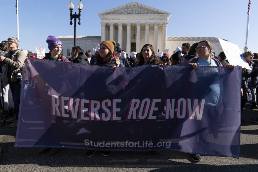 Anti-abortion protesters demonstrate in front of the U.S. Supreme Court Wednesday, Dec. 1, 2021, in Washington, as the court hears arguments in a case from Mississippi, where a 2018 law would ban abortions after 15 weeks of pregnancy, well before viability.  An expected decision by the U.S. Supreme Court in the coming year to severely restrict abortion rights or overturn Roe v. Wade entirely is setting off a renewed round of abortion battles in state legislatures. 