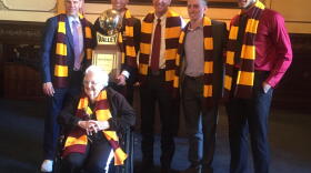 Governor Rauner poses with members of the Loyola men's basketball team, Coach Porter Moser, and Sister Jean.