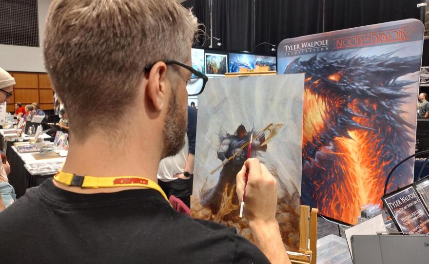 Tyler Walpole paints "Death Dealer" at the 2022 SiouxperCon
