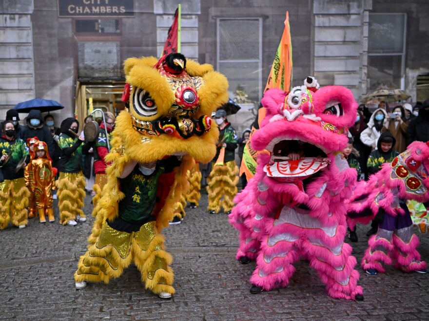 Members of the Scottish Chinese community take part in Edinburgh Chinese New Year Festival on Monday in Scotland. Chinese New Year in Edinburgh has become one of the largest celebrations of its kind in Scotland.