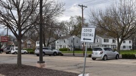 A sign directing people to the COVID-19 testing site set up in the old Kroger parking lot on Wisconsin Ave. in Peoria's East Bluff neighborhood.