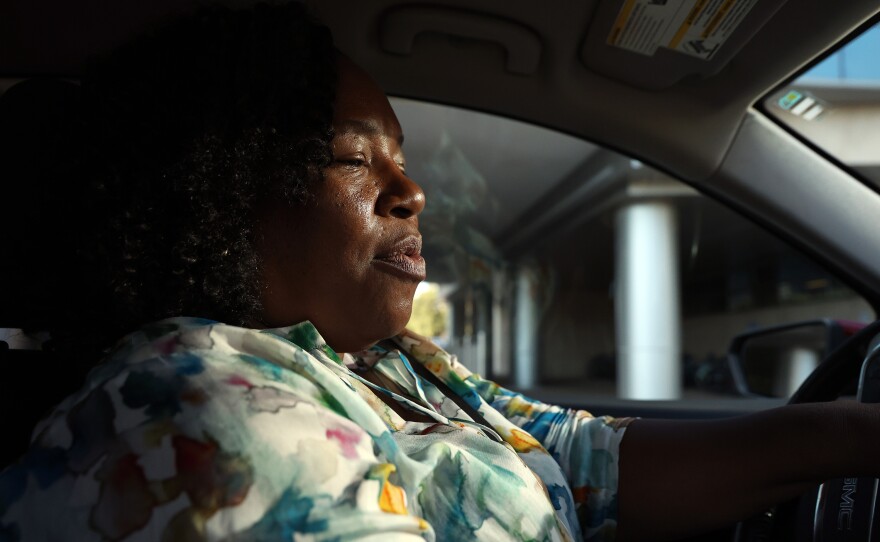 Jaquelyn “Jackie” King, a rideshare driver for the company Uber, waits for rider Jimmy Rochelle in Gainesville, Fla., on Thursday, Nov. 20, 2025. Rochelle was using the rideshare service to get home from the UF Shands Hospital.