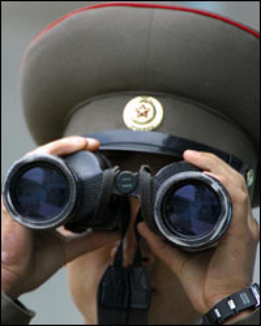 A North Korean soldier looks at the South side at the border village of Panmunjom in the Demilitarized Zone (DMZ) dividing North and South on Thursday.