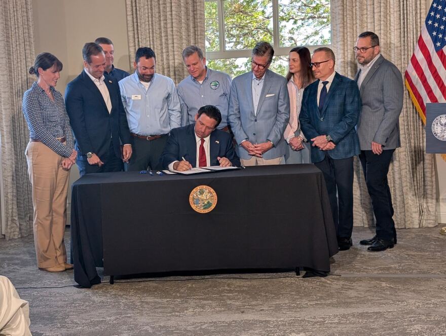 Gov. Ron DeSantis signs two bills at Pier 22 in Bradenton on March 19, 2026.