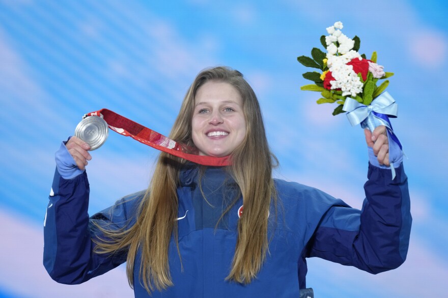 Julia Marino of the U.S. shows her silver medal for the snowboard event during the awards ceremony at the 2022 Winter Olympics, Sunday, Feb. 6, 2022, in Zhangjiakou, China.