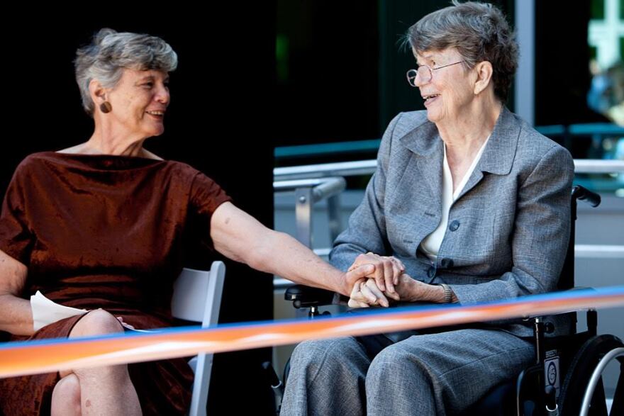 Reno and her sister, Maggy Hurchalla (left), attend the grand opening of UF's