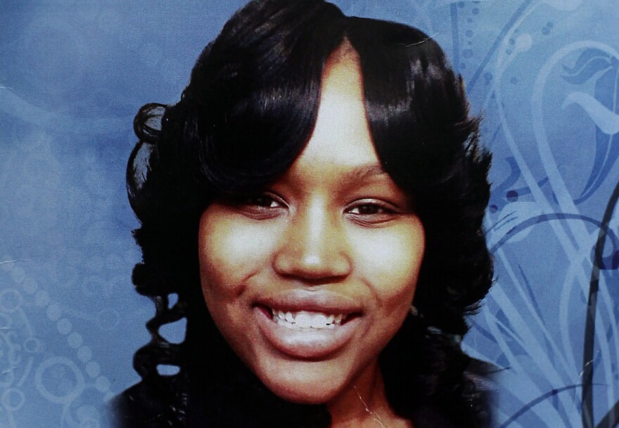 A photo of Renisha McBride on a program at her funeral service in Detroit. Murder charges have been filed over McBride's death from a shotgun blast at a house in Dearborn Heights, Mich., on Nov. 2.