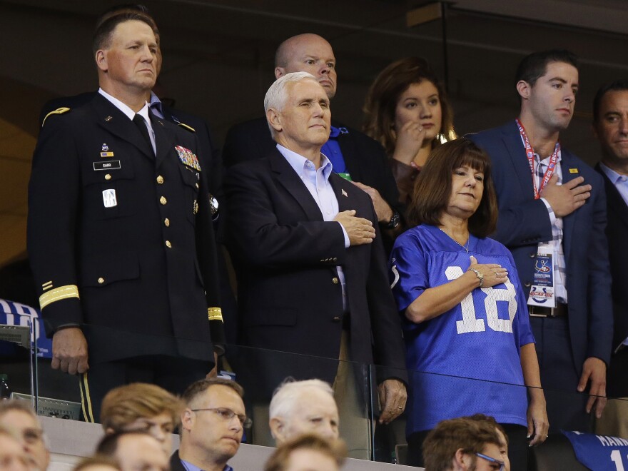 Vice President Pence and his wife, Karen, stand for the national anthem before Sunday's game between the Indianapolis Colts and the San Francisco 49ers in Indianapolis.