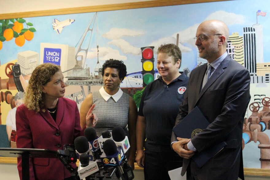 Democratic U.S. Reps Debbie Wasserman-Schultz and Ted Deutch support furloughed South Florida HUD workers Denise Benjamin and Peggy Johannsen in Plantation on Tuesday, Jan. 8, 2019. 