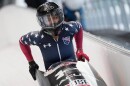 Winner Kaysha Love of the United States celebrates after the women's monobob race at the Bobsleigh World Cup in Innsbruck, Austria, Saturday, Nov. 29, 2025.
