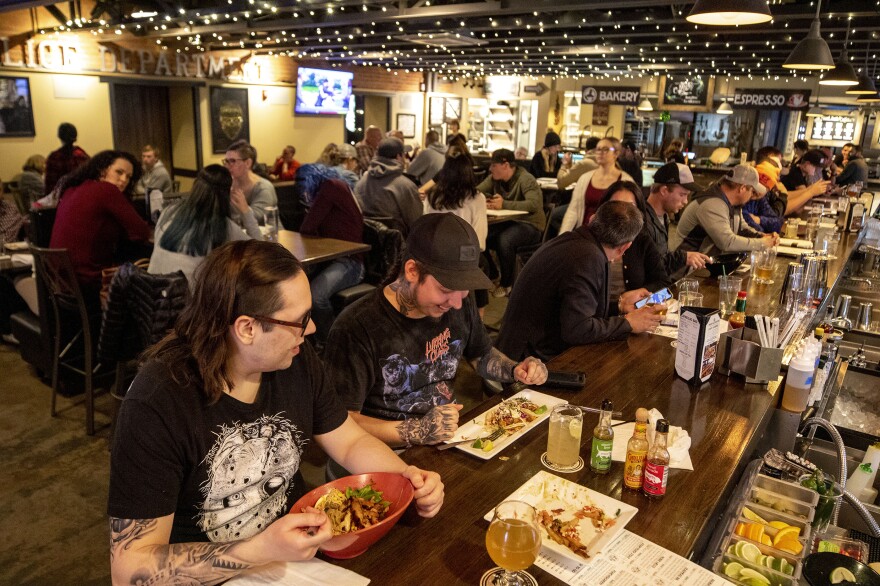 Connor Moore and Matt Gallegos, who grew up in Pueblo, sit at the end of the bar inside Brues Alehouse Brewing Company.