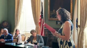 Councilor Tara Jacobs (right) spoke during a Governor's Council assembly on Wednesday, July 10, 2024, and called on Gov. Maura Healey (center) to fill a number of court vacancies.