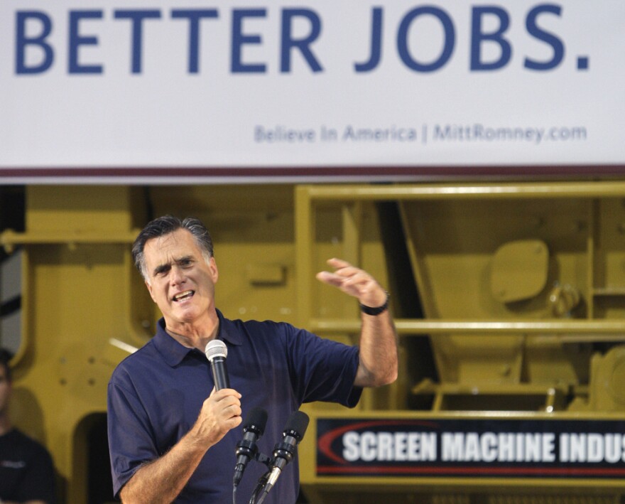 Former Massachusetts Gov. Mitt Romney speaks in the warehouse during a campaign stop in Pataskala, Ohio, last month. He opposed the debt-ceiling legislation signed by President Obama on Tuesday.