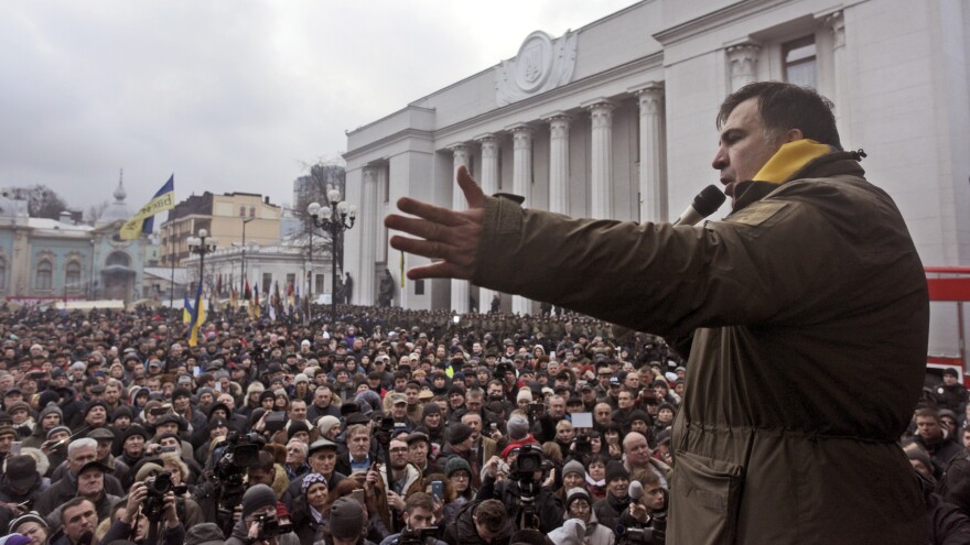 Saakashvili addresses his supporters after escaping from law enforcement and leading them on a march toward the Parliament building in Kiev on Tuesday.