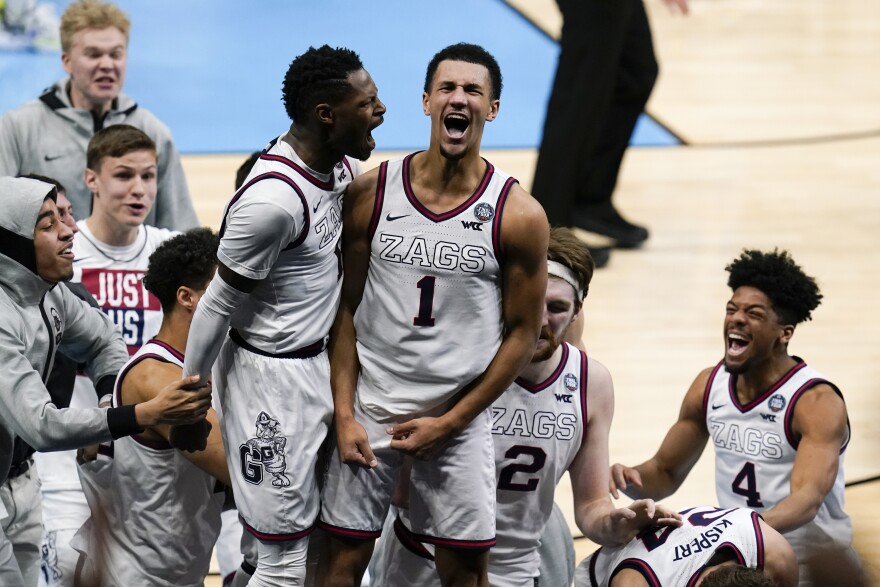 Gonzaga guard Jalen Suggs (1) celebrates making the game-winning basket with Joel Ayayi, left, against UCLA during overtime in a men's Final Four NCAA college basketball tournament semifinal game April 3, 2021, at Lucas Oil Stadium in Indianapolis. 