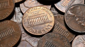 A close-up of a pile of United States pennies.