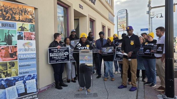 Open Buffalo Executive Director Franchell Parker (at podium) joins other local leaders in calling for stronger protections for voters’ rights and increased participation ahead of Election Day during a rally Friday, Oct. 30, 2026.