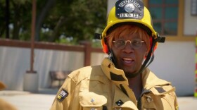 Screenshot of Fontana Mayor Acquanetta Warren dressed in firefighter gear from an episode of CBS's Undercover Boss.