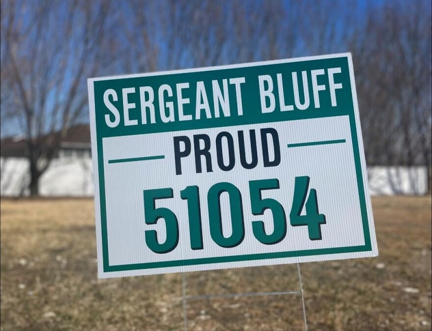 A sign reads "Sergeant Bluff Proud - 51054"