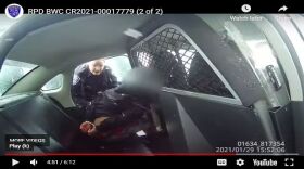A screen grab from a Rochester Police Department body-worn camera that captured a female officer pepper-spraying a 9-year-old handcuffed girl.
