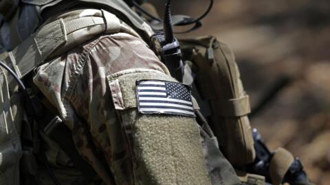 A U.S. flag patch adorns the uniform of a paratrooper, April 21, 2017, during a training exercise at Fort Bragg, N.C. (Gerry Broome/AP)