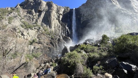 Visitors take in a view of Bridalveil Fall Thursday, Feb. 20, 2025, in Yosemite National Park, Calif. (AP Photo/Haven Daley)