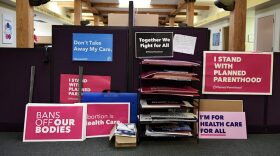 Signs lean against the wall at the Planned Parenthood in St. Louis’ Central West End.