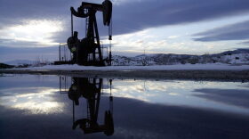  A winter sunrise surrounds an oil well in the South Cuyama Oil Field