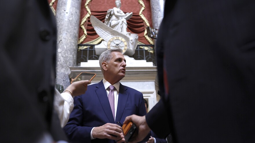 House Speaker Kevin McCarthy speaks to reporters as he walks to the House floor on Tuesday.