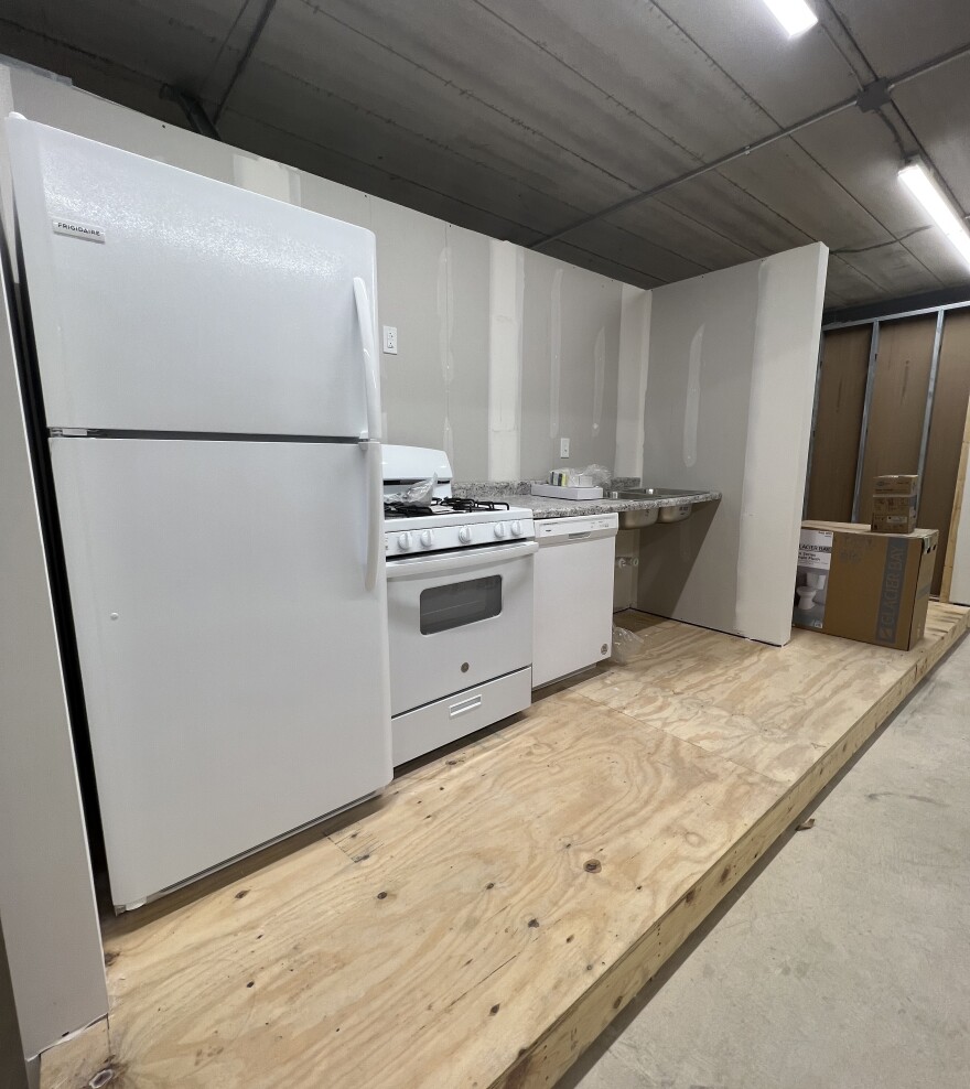 A fake kitchen is set up in a classroom setting