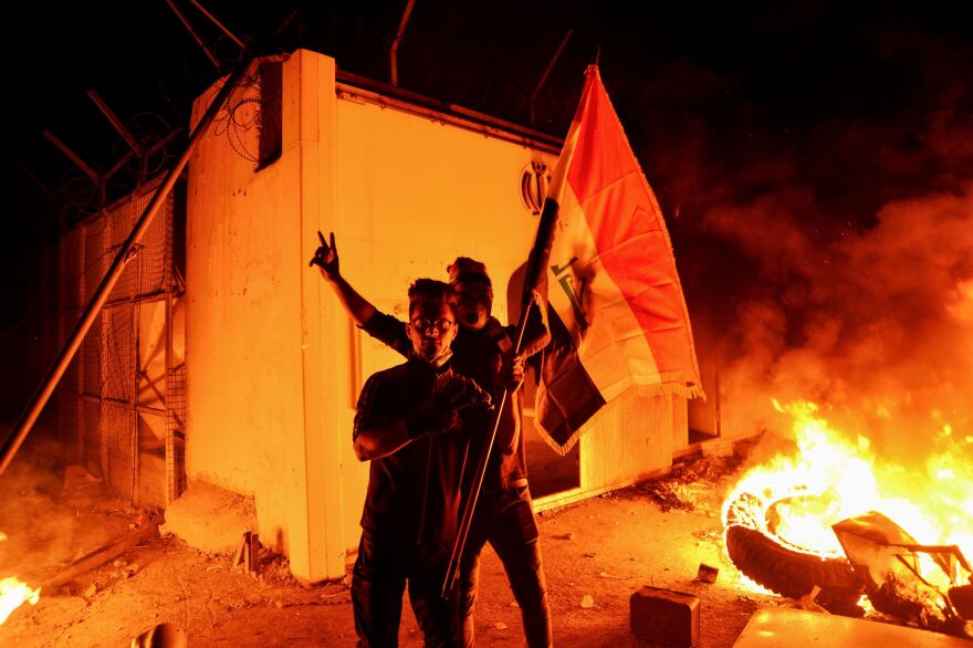 Iraqi demonstrators stormed and set fire to Iran's consulate in the southern Iraqi city of Najaf on Wednesday.