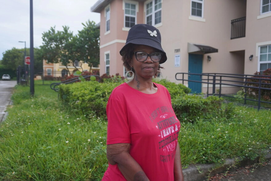 North Park at Scott Carver resident Caprice Brown stands in front of the Liberty City apartment complex. Brown has lived at the property for 13 years and has raised concerns about living conditions and management practices at the development.