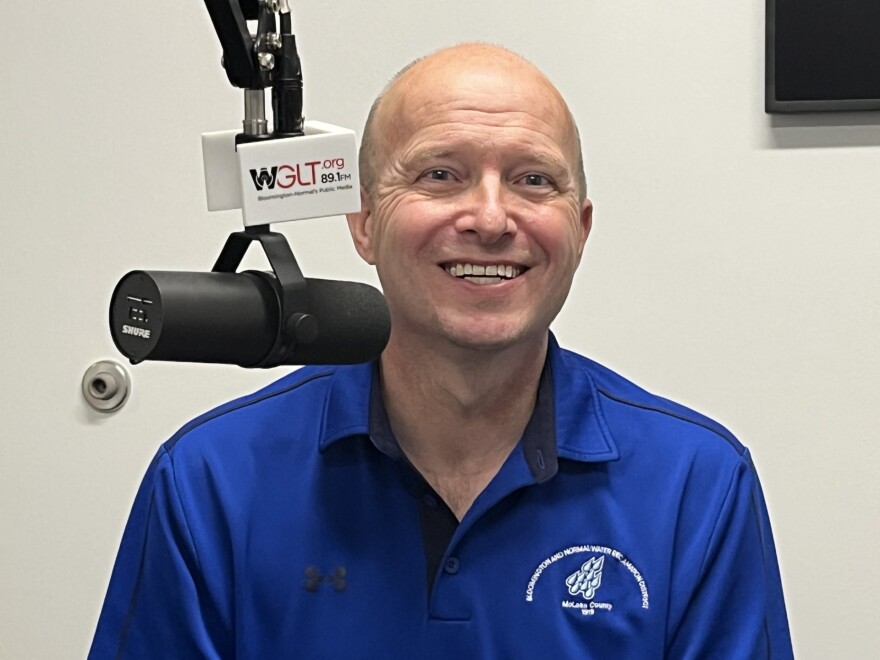 BNWA man in a bright blue shirt, Tim Ervin, that has a logo of drops of water for the Bloomington Normal Water Reclamation District.