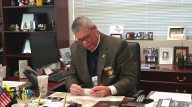 Sam Paeg at his desk