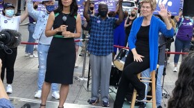 City councilor and mayoral candidate Michelle Wu was joined by Sen. Elizabeth Warren at a rally in Chinatown on Saturday. (Anthony Brooks/WBUR)