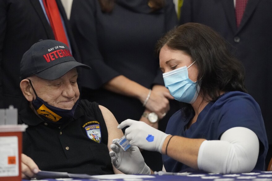 Bay of Pigs invasion veteran Rigoberto Montesinos, 82 gets vaccinated at the Bay of Pigs Museum and Library in the Little Havana on Feb. 8. The North Florida/South Georgia Veterans Health System is expanding their vaccine eligibility to high-risk veterans under 65. (AP Photo/Wilfredo Lee)