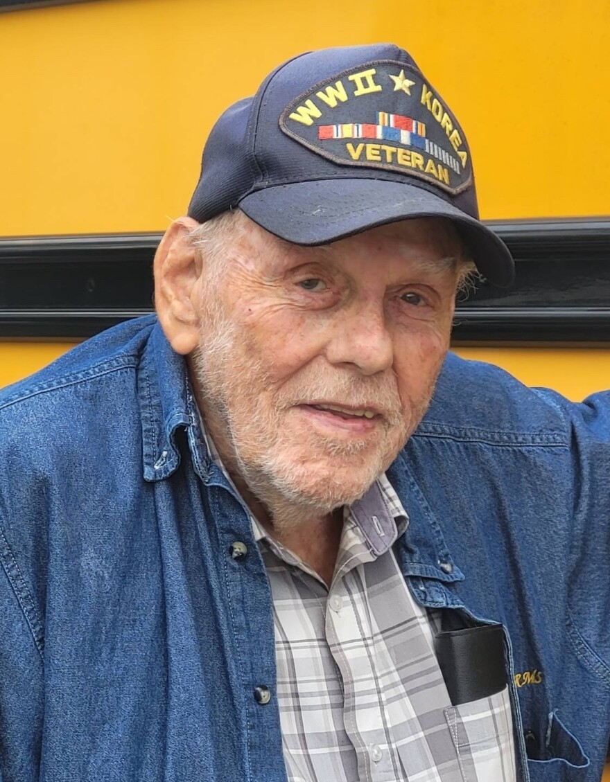 The Children’s Table co-founder Bill Brown, known as "Mr. Bill," in front of the mobile food pantry bus.