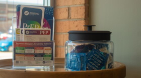 A jar of condoms and pamphlets for HIV prevention medication sits inside the waiting room of the New Hope Wellness Center, the clinical arm of Guiding Right. The public health nonprofit has received direct federal funding for decades, but now those dollars are being redirected to state health departments.