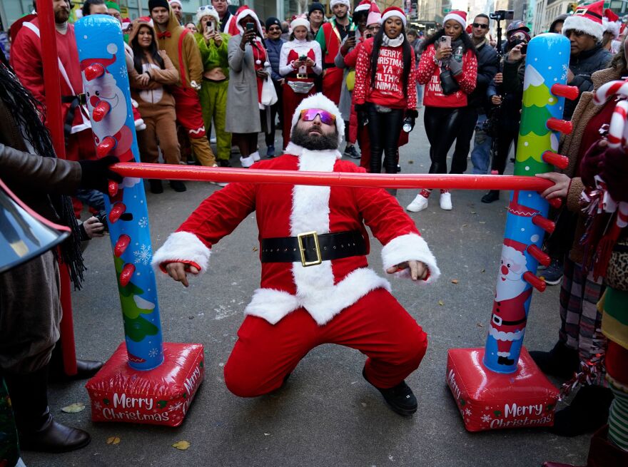 SantaCon participants celebrate the beginning of the pub crawl in Times Square.